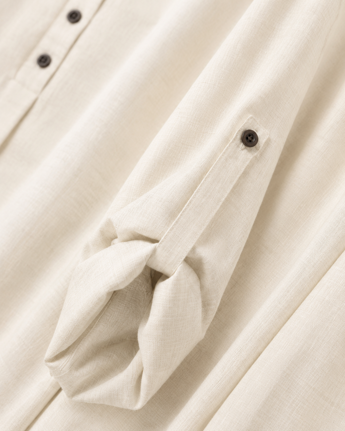 Cotton-Linen Bone White rolled sleeve tab fastened to its button
